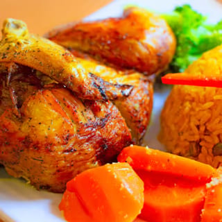 Family Combo ( Whole Rotisserie Chicken + Pork Chops, Rice-peas Or White Rice-Beans; Or Sweet Plantains) 2 Litter Soda